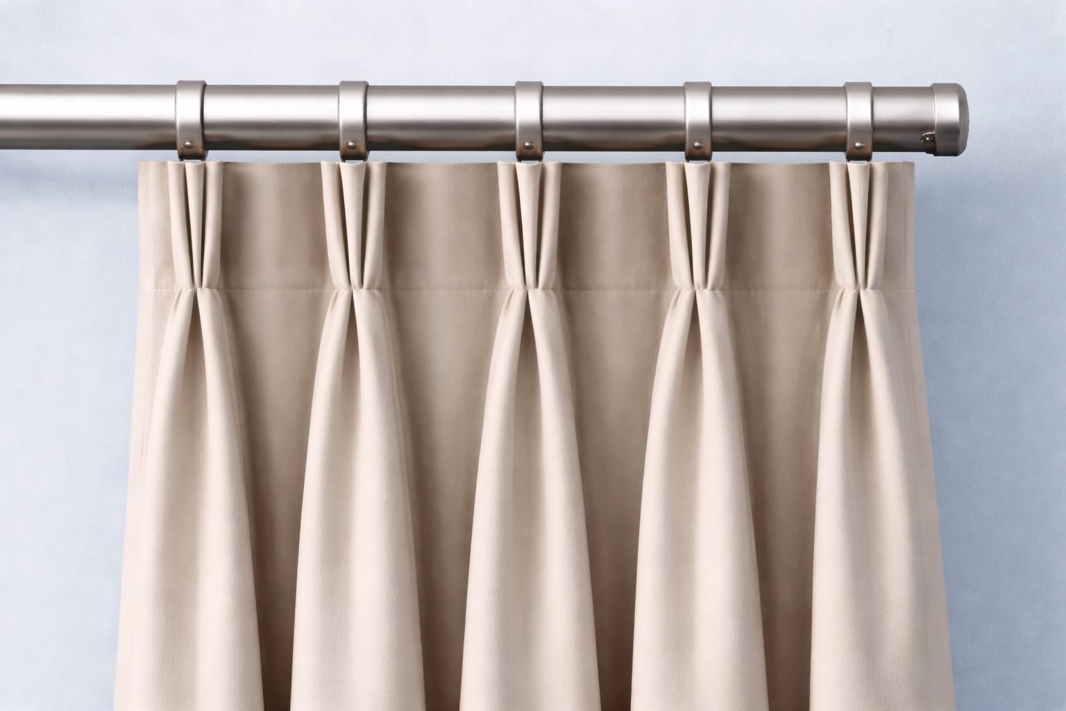 Narrow, tailored pleats sewn at the top provide a sleek, tailored look.