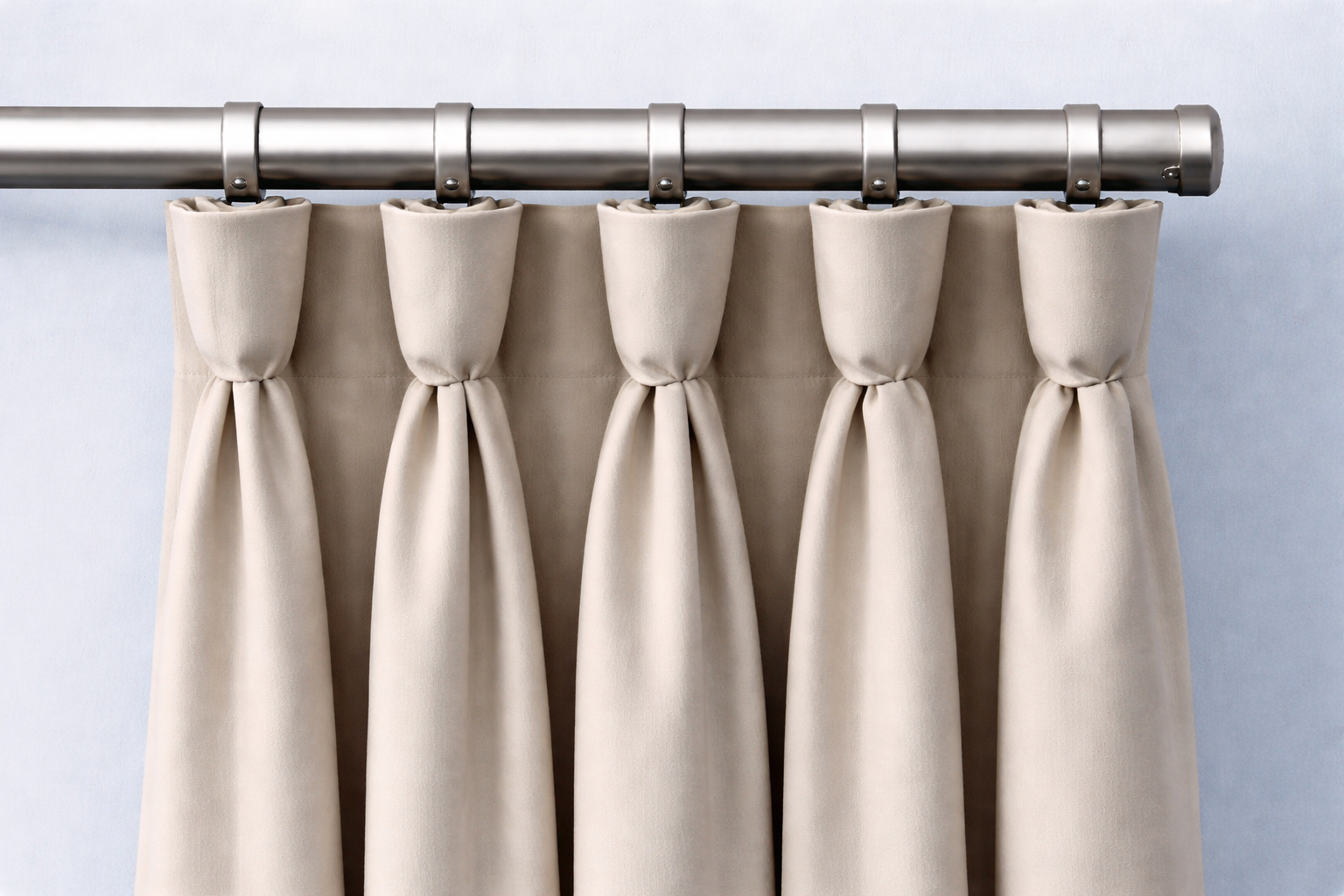 Decorative, goblet-shaped pleats create a traditional, elegant style.